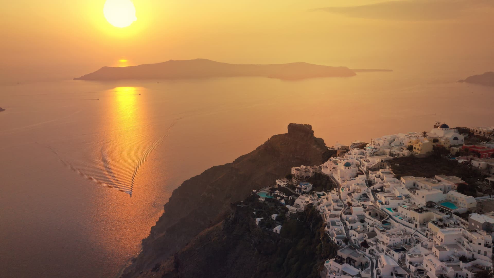 Golden sunset over Santorini and the Aegean Sea